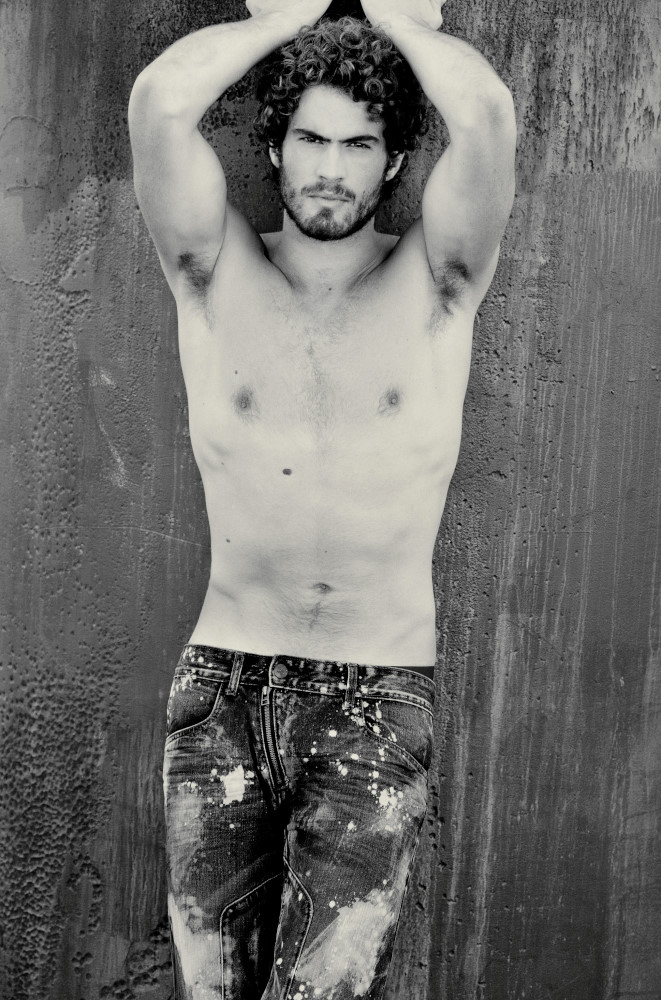 Body shot of an attractive male model, photographed in balck and white for a mens jeans campaign by Kent Johnson. 