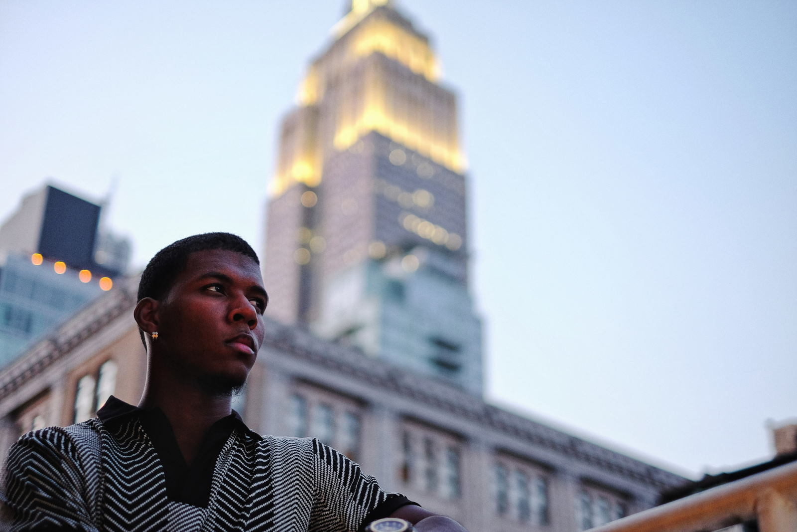 On dusk, penthouse terrace Manhattan, Empire State building in the background - Menswear photoshoot at at The Roger Hotel NYC for fashion label Mario&Lee. Photography by Kent Johnson.