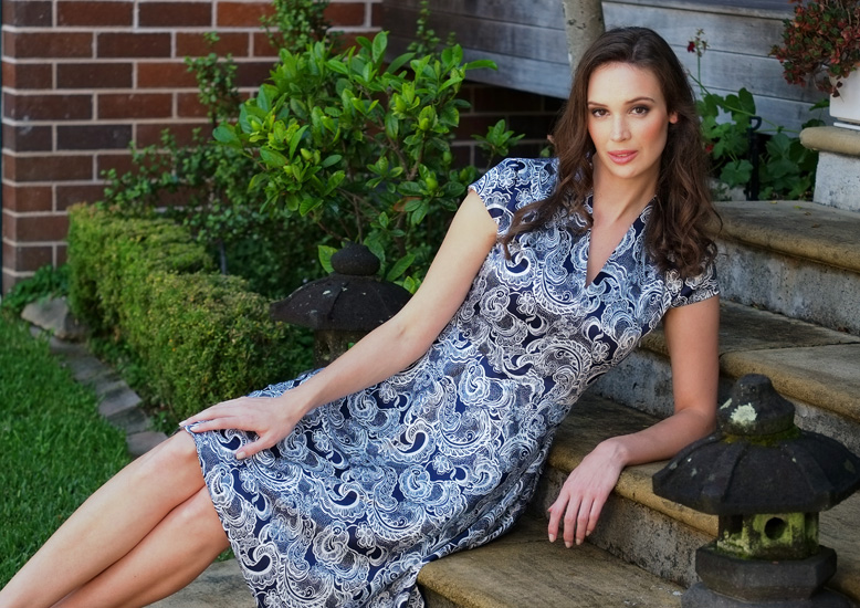 Fashion campaign photographed on location by Kent Johnson. Model wears a paisley dress vee neck short sleeves.