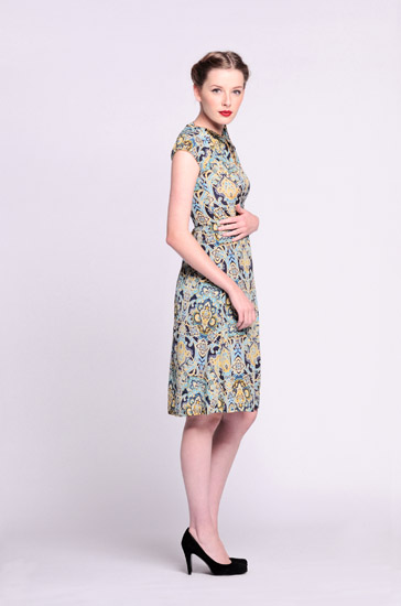 Sydney fashion photographer Kent Johnson photographs a model wearing a retro paisley dress on a white background.