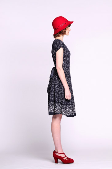 Black and white print dress bow at back, Studio Fashion Photography by Kent Johnson.  Marketing campaign shot on white background.