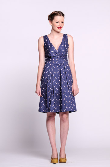 Blue print wrap dress, Studio Fashion Photography by Kent Johnson. Vintage style fashion marketing campaign, model on white background.