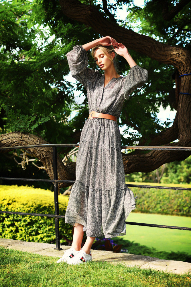Model in summer dress under a tree, Fashion Branding.