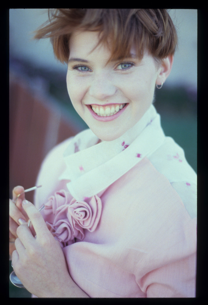 Fashion Test, Miriam, 35mm late 80s model in pink dress holding glasses