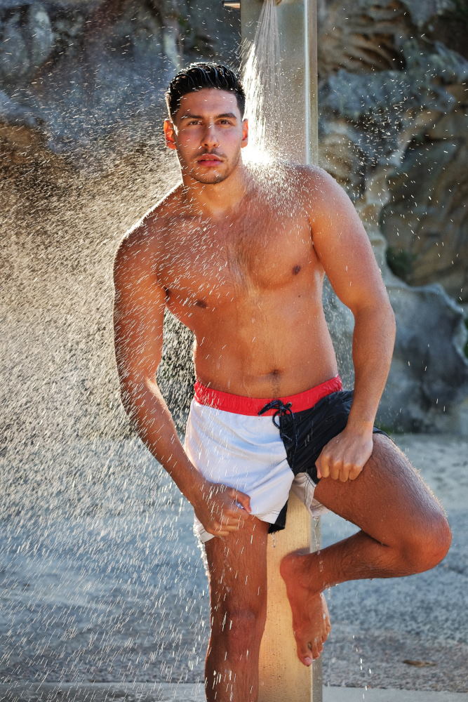 Male modelling portfolio, beach shower after workout - male modelling, health and fitness on location Sydney, Australia - Photographed by Kent Johnson.