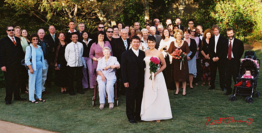 Family and friends large group portrait at wedding, on location, Gosford NSW. Photographed by Kent Johnson.