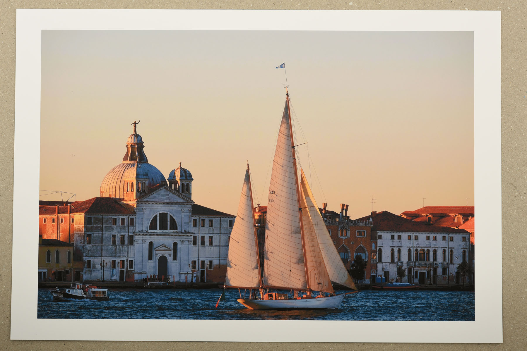 Sailing past Santissimo Redentore. La Serenissima an exhibition of photographs and fine art prints by Kent Johnson Print of a yacht sailing past Santissimo Redentore at dawn, Venice, Italy. La Serenissima an exhibition of photographs and fine art prints by Kent Johnson