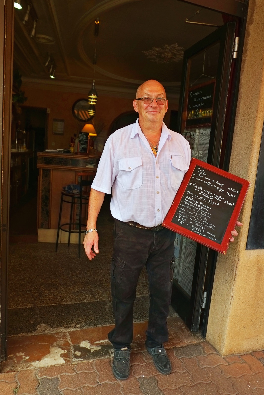 Portrait of chef Michel Herbet at his bar-restaurant-pizzeria Le Petit BAGNOLAIS. Lifestyle travel and people photography by Kent Johnson.