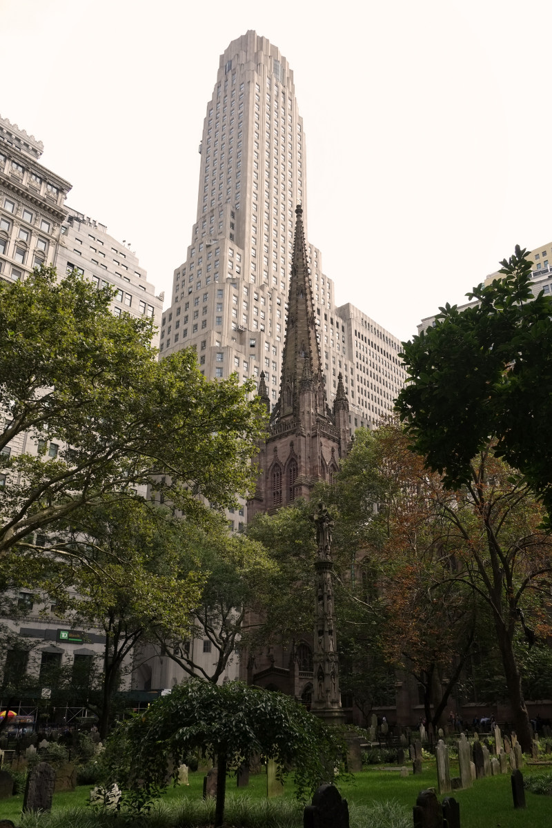 Art Deco monumental skyscraper One Wall Street and Trinity Church  Manhattan NYC - cemetery, graves, graveyard