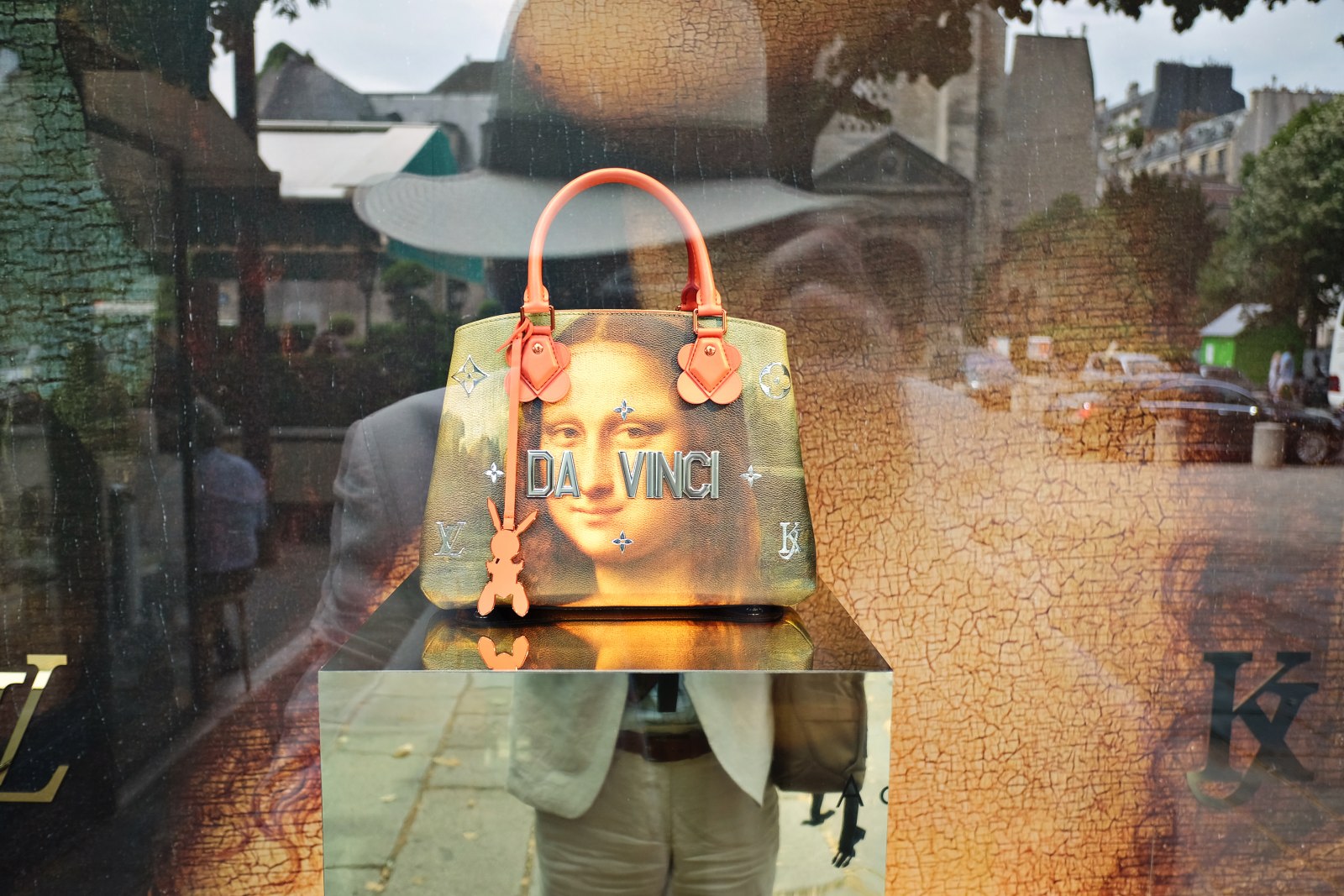 Jeff Koons LV collab - Da Vinci handbag and reflection; Boulevard Saint-Germain, Paris. Street style travel photography by Kent Johnson.