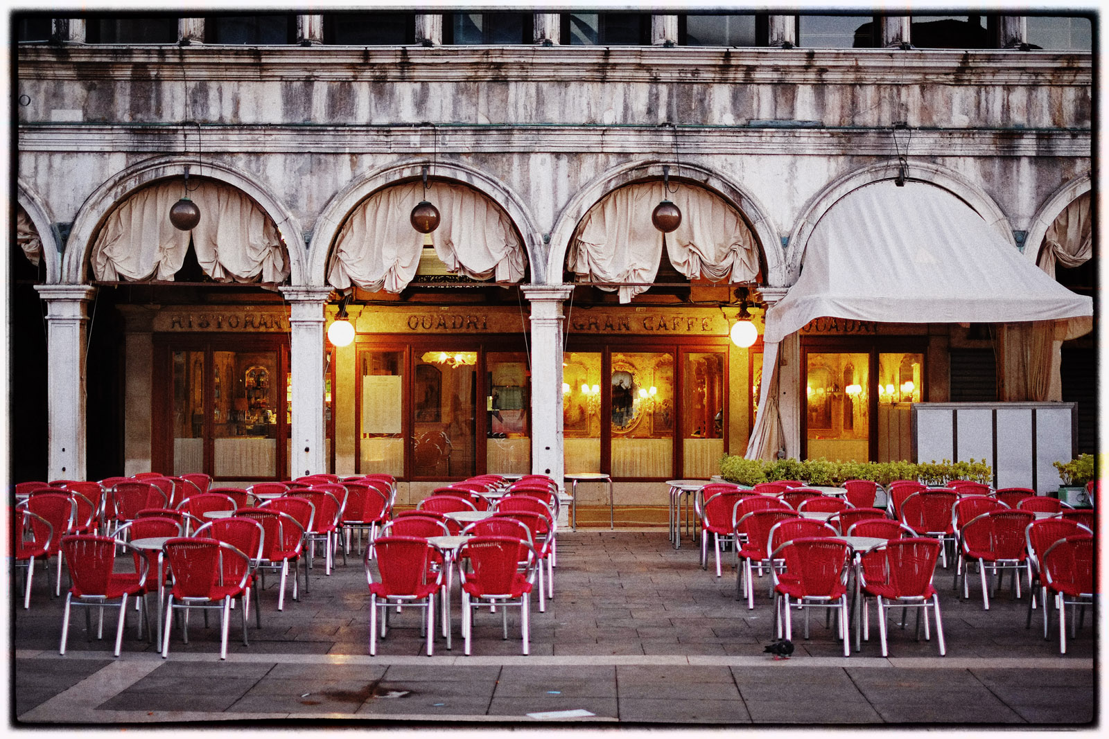 Early morning piazza San Marco, Tables and Chairs, Quadri Gran Caffe. Travel photography by Kent Johnson.
