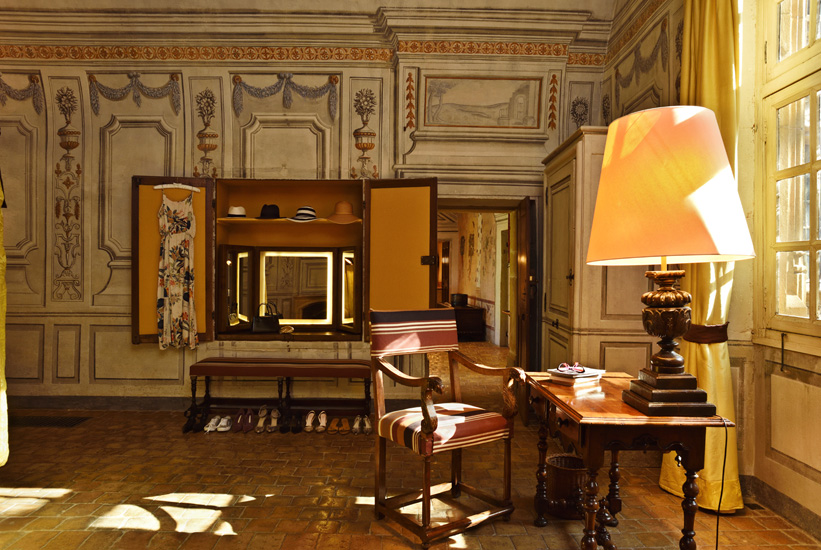 Dressing room make-up mirror, painted wall mural, writing table and view to living room. A luxury suite in a restored French château, Bagnols, Beaujolais. Hotel, resort and travel photography by Kent Johnson.