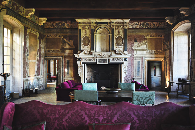 The Grand Salon, Château de Bagnols with large oranate marble fireplace and painted murals. Hotel, resort and travel photography by Kent Johnson.