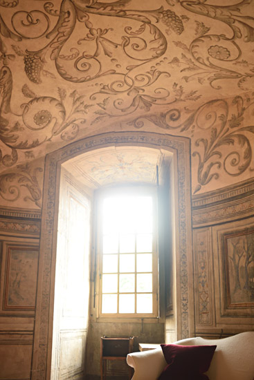 Ceiling and window detail featuring classical painted patterns and window light. Travel and architecture photography by Kent Johnson.