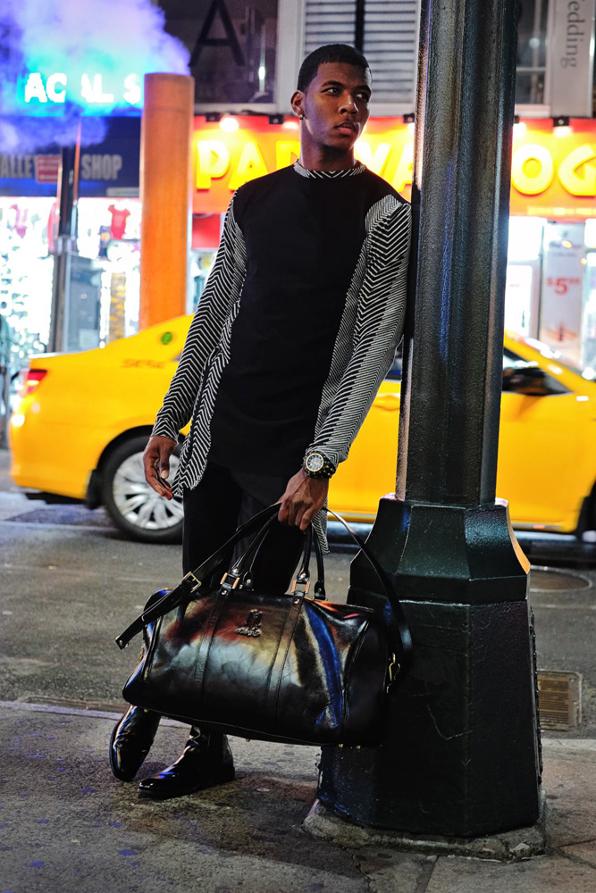 Long sleeve tee from the versed capsule collection, street scene with road steam, yellow cab and neon signs. Menswear photographed in New York City by Kent Johnson.