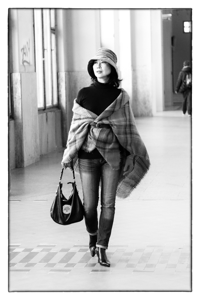 Viviennne walking through central station, Prague. Fashion Photography by Kent Johnson for White Caviar Life.
