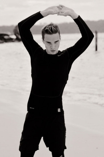 Leo on the beach in black running kit - Male model portfolio photoshoot, Sydney, Australia.