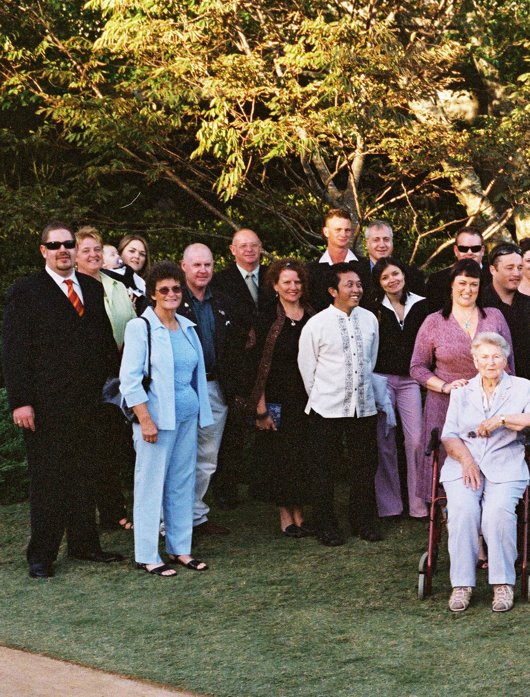 The wedding party, bride and groom and all the guests in a beautiful Japanese garden, Gosford NSW.