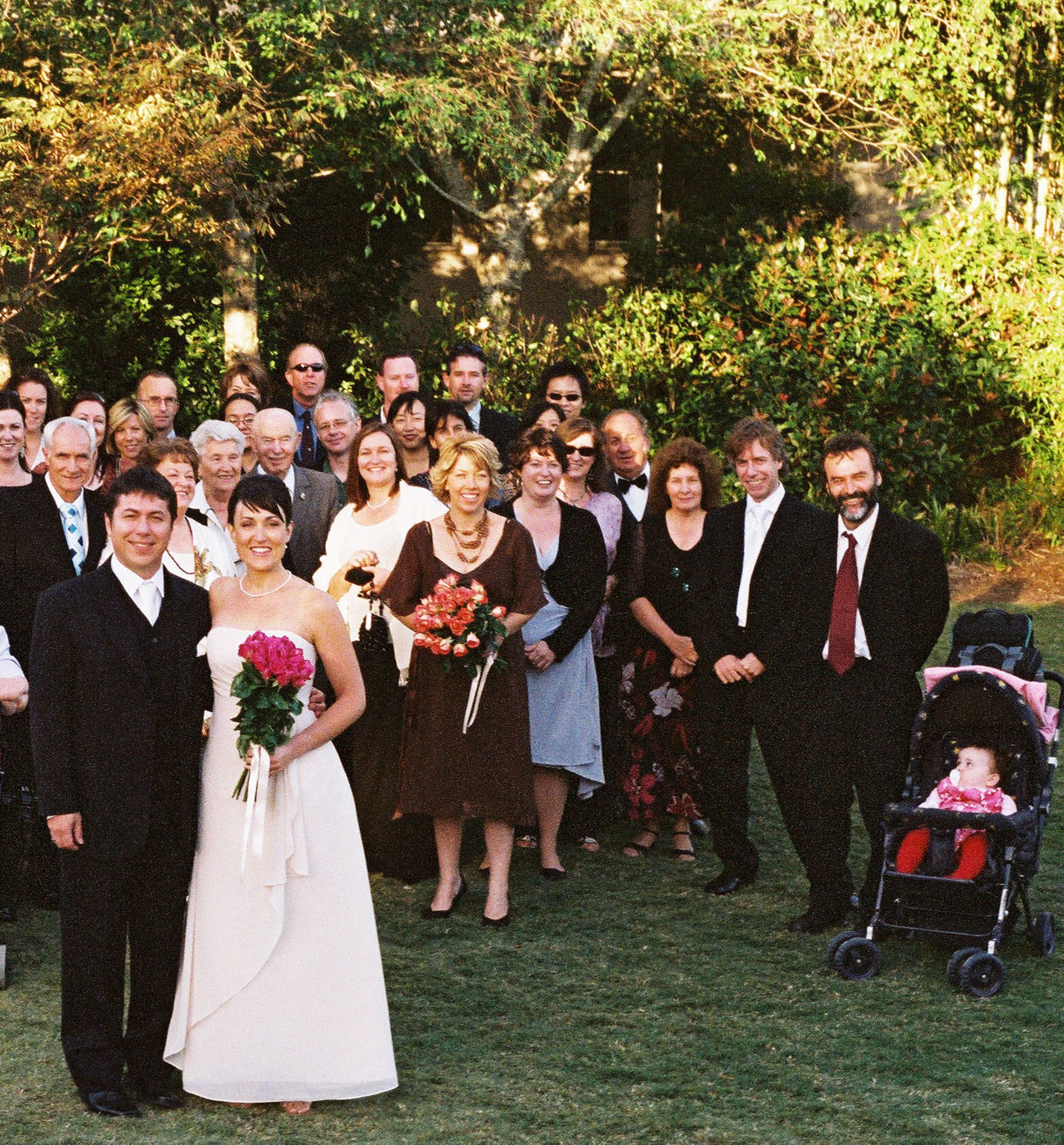 The wedding party, bride and groom and all the guests in a beautiful Japanese garden, Gosford NSW. Kent Johnson Photography, Sydney, Australia.