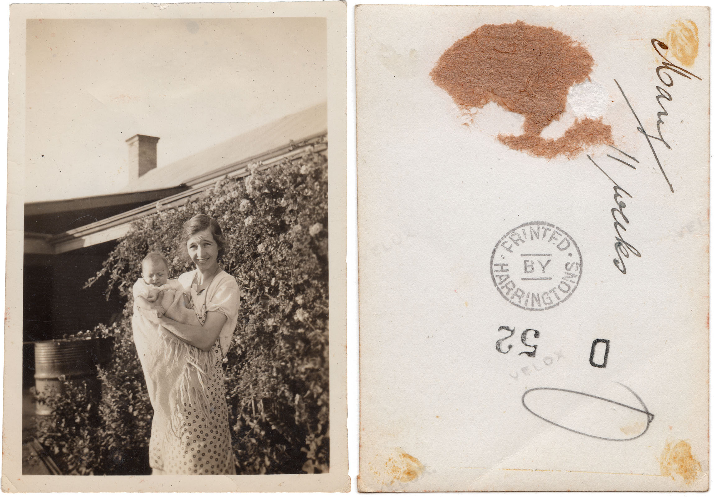 An old black and white photograph from the 1930s of My grandmother holding my mother